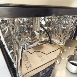 Foil-faced insulation installed inside a modified prefabricated fireplace behind a gas insert in Collegeville, PA